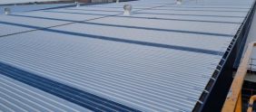 Kliplok Zincalume metal roof sheeting and vertical Colorbond cladding installation, Truganina logistics hub